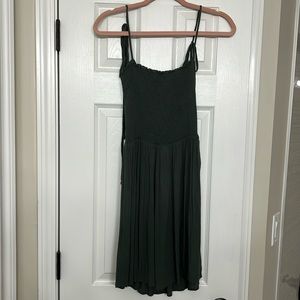 Army green sundress. Smocked top and flowy bottom. Hits right above the knees.